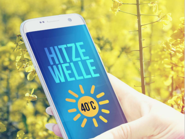Ein Smartphone mit der Meldung "Hithzewelle"